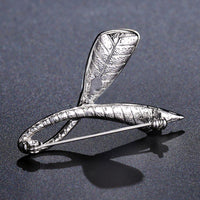 Side angle view of Khaista blue Austrian leaf brooch