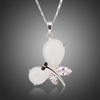 KHAISTA crystal dragonfly pendant necklace on white background