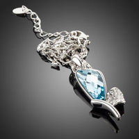 Side angle view of KHAISTA crystal dragonfly wings chain necklace