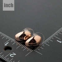 egg shape crystal stud earrings detail view by KHAISTA