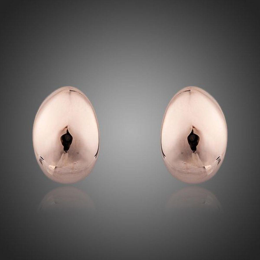 KHAISTA egg shape crystal stud earrings on white background