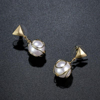 elegant pearl drop earrings detail view by KHAISTA