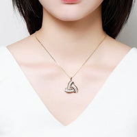 Side angle view of KHAISTA end to end crystal leaf necklace