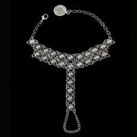 Close-up of crystal stones on silver barefoot anklet