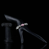 Side angle view of KHAISTA fashion charm crystal bracelet