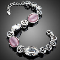 Close up detail of KHAISTA fashion charm crystal bracelet