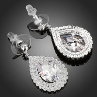 Close up of KHAISTA fashion CZ drop earrings