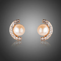 KHAISTA pearl half ellipse rhinestone stud earrings on white background