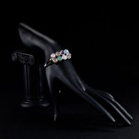Side angle view of KHAISTA fashionable crystal strand bracelet