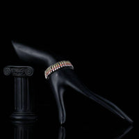 Side angle view of KHAISTA fireflies CZ cuff bracelet