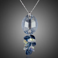 KHAISTA crystal fish design pendant necklace on white background