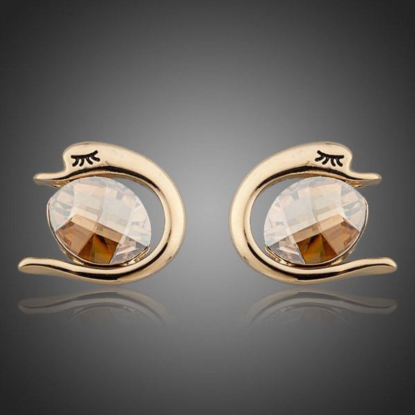 KHAISTA crystal fish porpoising stud earrings on white background