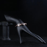 Side angle view of KHAISTA crystal fish bracelet