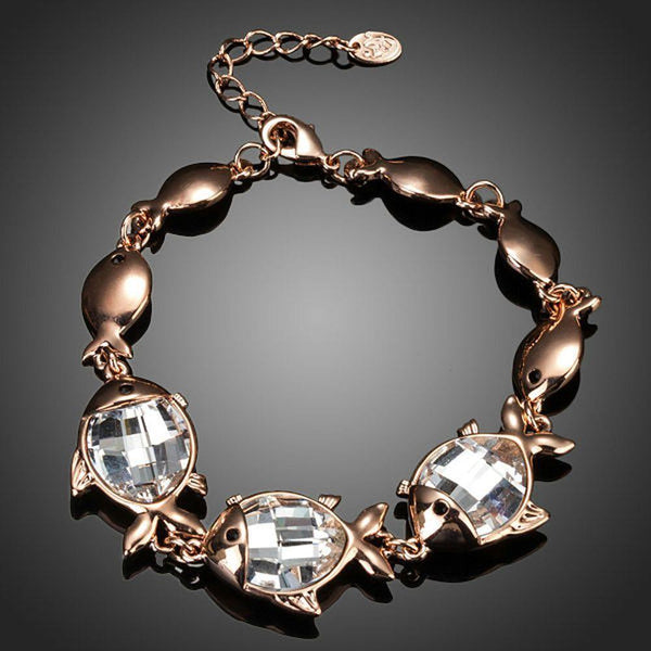 KHAISTA crystal fish bracelet on white background