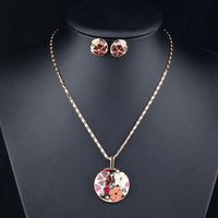 Side angle view of Khaista floral crystal set