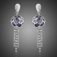 KHAISTA flower crystal tassel drop earrings on white background