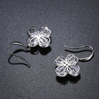 flower CZ drop earrings detail view by KHAISTA