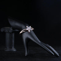 Side angle view of KHAISTA flower design CZ bangle