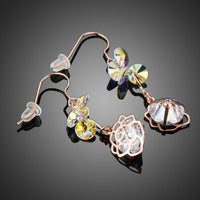 Close up of KHAISTA flower crystal drop hook earrings