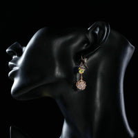 Side angle view of KHAISTA flower crystal drop hook earrings