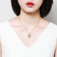 Pendant detail on KHAISTA green CZ flower pendant necklace