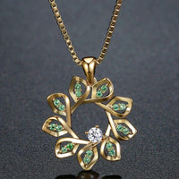 KHAISTA green CZ flower pendant necklace on white background