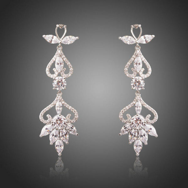 KHAISTA flower shape crystal drop earrings on white background