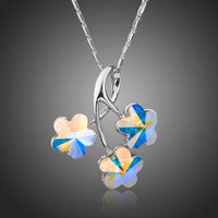 KHAISTA flower long chain pendant necklace on white background