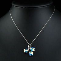 Close up detail of KHAISTA flower long chain pendant necklace