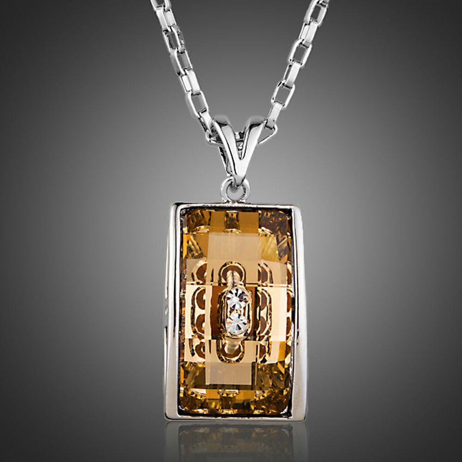 KHAISTA geometric champagne crystal pendant necklace on white background