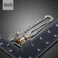 Pendant detail on KHAISTA geometric champagne crystal pendant necklace