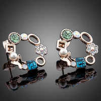 Close up of KHAISTA geometric circle crystal stud earrings
