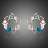KHAISTA geometric circle crystal stud earrings on white background