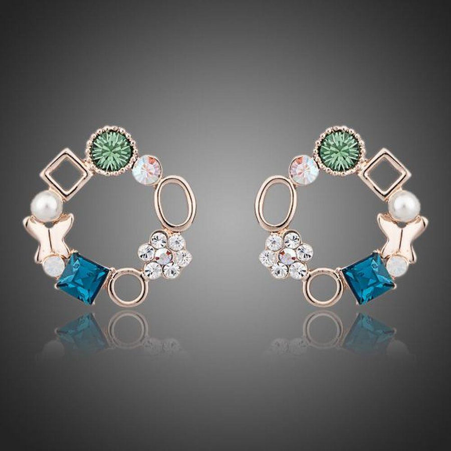 KHAISTA geometric circle crystal stud earrings on white background