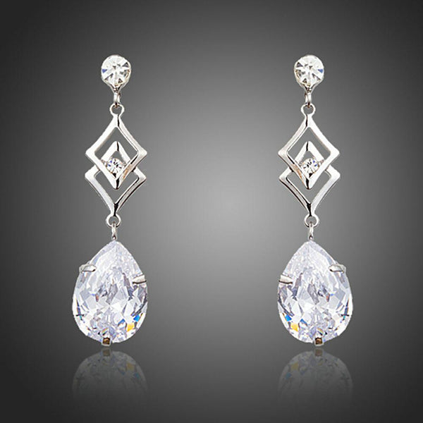 KHAISTA geometric CZ earrings on white background