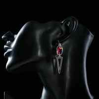 Side angle view of KHAISTA geometric design crystal drop earrings