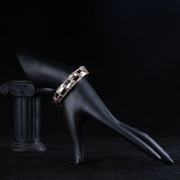Side angle view of KHAISTA geometric designer crystal bangle