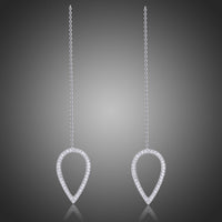 KHAISTA geometric long drop earrings on white background