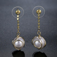 geometric pearl drop earrings detail view by KHAISTA