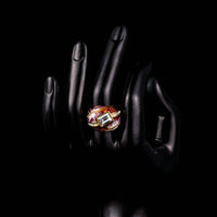 Side angle view highlighting the comfortable band silhouette of the luxury red geometric crystal ring