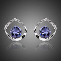 KHAISTA geometric sea blue crystal stud earrings on white background