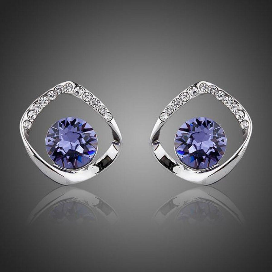 KHAISTA geometric sea blue crystal stud earrings on white background