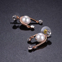 geometric pearl rhinestone dangle earrings detail view by KHAISTA