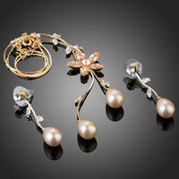 Side angle view of Khaista gold pearl CZ set