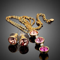 Side angle view of Khaista gold crystal hoop set