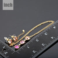 Gold hoop earring detail by Khaista