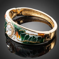 Close up detail of KHAISTA gold plated artistic paved cuff bangle
