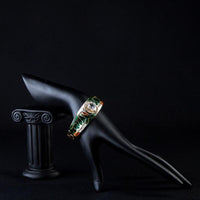 Side angle view of KHAISTA gold plated artistic paved cuff bangle
