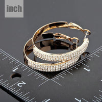 gold plated bangle design drop earrings detail view by KHAISTA
