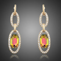 KHAISTA gold plated chain circle drop earrings on white background